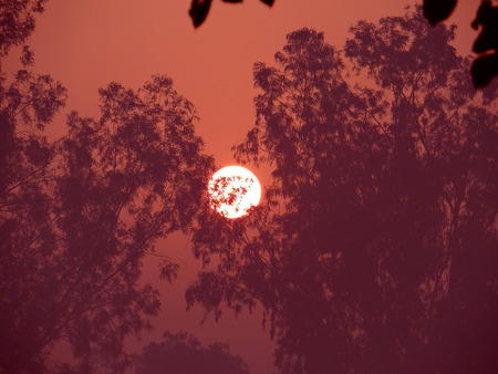 A sunrise view in a rural hilly regionの写真素材