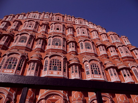 The renowned 'Palace of The Winds', or Hawa Mahal, is one of the prominent tourist attractions in Jaipur city. Located in the heart of Jaipur, this beautiful five-storey palace was constructed in 1799 by Maharaja Sawai Pratap Singh who belonged to Kachhwaのeditorial素材