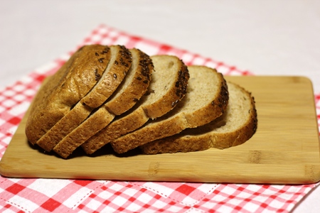 Slices of white bread lying on a wooden Board