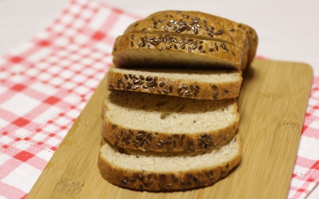 Slices of white bread lying on a wooden Board