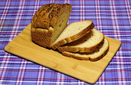 Bread. Wheat bread products are on blue tartan
