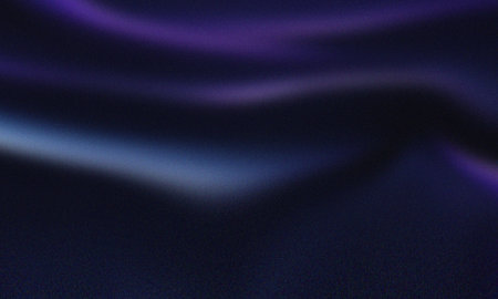 Abstract wavy dark blue and purple gradient background with subtle textureの写真素材