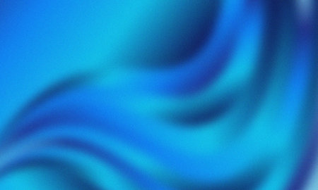 Abstract wavy flowing blue and cyan gradient with subtle grain texture backgroundの写真素材