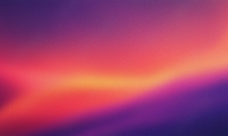 Vibrant gradient background with warm color blend and subtle grain textureの写真素材