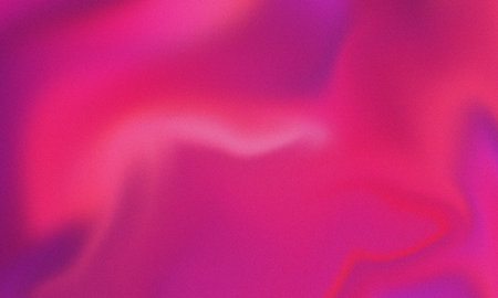 Smooth vibrant pink and purple gradient background with subtle noise grainの写真素材