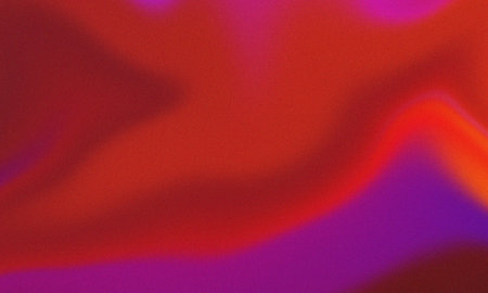 Vibrant red orange purple abstract gradient with grain noise texture overlayの写真素材