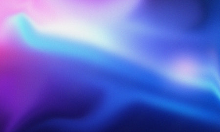 Vibrant purple and blue gradient background with soft light and textured grainの写真素材