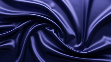 A close-up view of rich, deep blue satin fabric, showcasing its luxurious texture, flowing folds, and gentle sheen.の素材