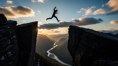 Dramatic moment of a lone figure jumping across a chasm at dawn, symbolizing risk, adventure, and overcoming challenges in business or lifeの素材