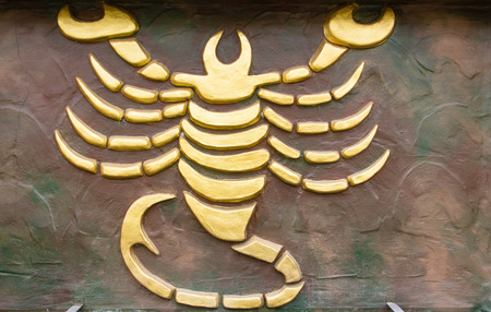 Scorpio sign of horoscope on the wallの写真素材