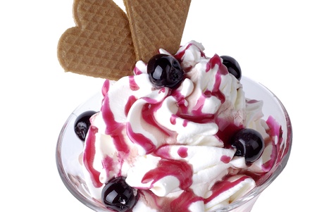 Ice cream dessert with cherry and whipped cream