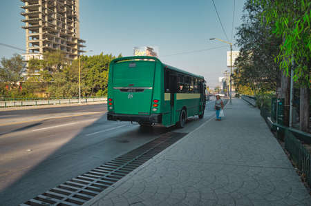 Green public transportation bus in Tijuana, Mexico.のeditorial素材