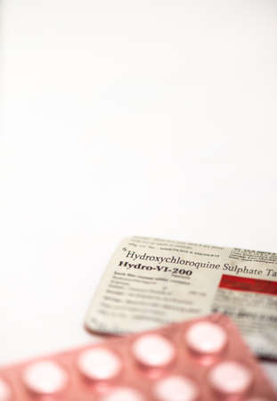 Hydroxychloroquine pills generic Plaquent on white background, vertical