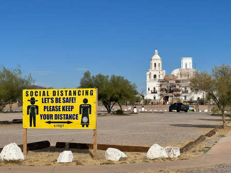 Social distancing sign in parking lot of Tucson church.のeditorial素材