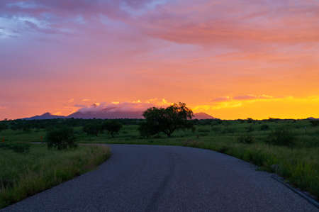 Vibrant sunset in Sonoita Arizona, road leading into the distance.の写真素材
