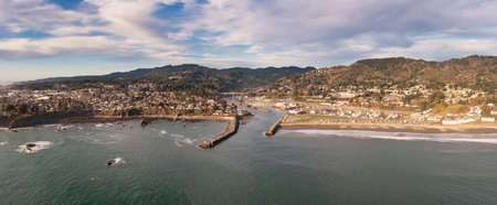Brookings, Oregon, USA. Panorama of harbor entrance and mouth of Chetco Riverの写真素材