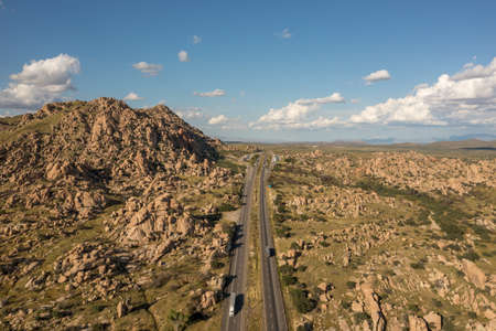 Trucks and cars on Arizona freeway, drone view