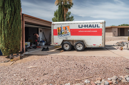 U-haul moving trailer parked in front of a residence.のeditorial素材