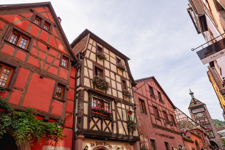 Old homes, stores and church with beautiful architecture in Alsace.のeditorial素材