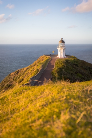 Cape Reinga on the North Island of New Zealand  Pacific Ocean hitting the Tasman Sea の写真素材