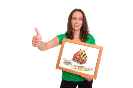 Young woman happy about her new home being financedの写真素材