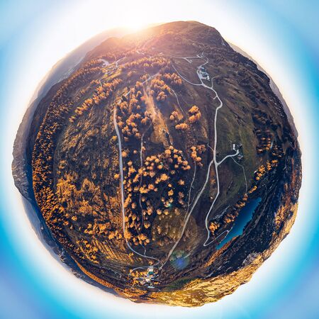 Tinyplanet composing of the Austrian Alps during autumn time. Tauplitzalm in Ennstal during the sunset.の写真素材