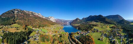 Grundlsee view in the famous Salzkammergut in Austria. Wonderful autumn weather scenery of the village, the lake and mountains of the Austrian Alps.の写真素材