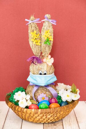 Funny Easter Bunny with easter eggs and Coronavirus face maskの写真素材