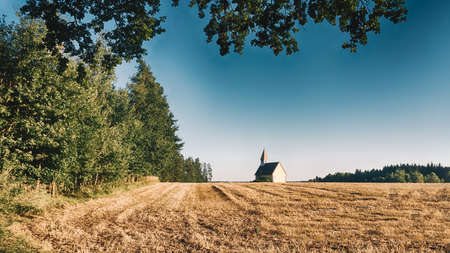 Idyllic chapel in Waldviertel, Lower Austria. Beautiful scenery of a romantic church in rural fields during summer.の写真素材