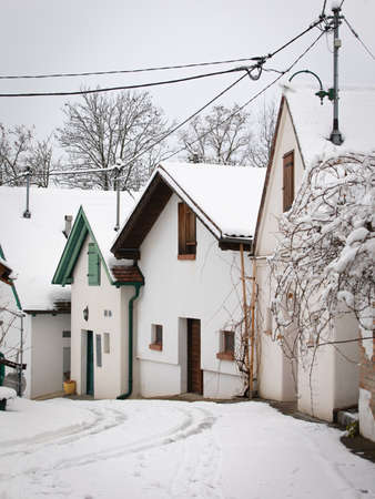 Wine cellar street in Weinviertel, Lower Austria during Winter. Snow covered winetasting places.の写真素材