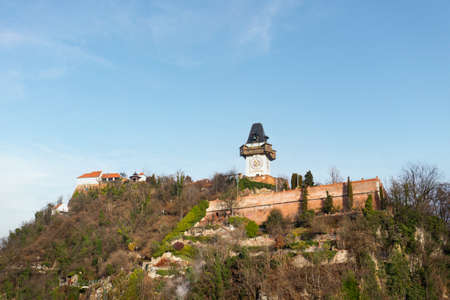 Graz Clock Tower landmark in Styria, Austria. Famous touristic destination on a beautiful winter day.の写真素材