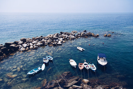 Coastal landscape scene with some boats in the idyllic blue european sea. Crystal clear and clean water in South Europe.の写真素材