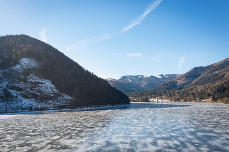 Frozen Lake Erlaufsee in Lower Austria and Styria used for natural ice skating on a beautiful cold winter day.の写真素材