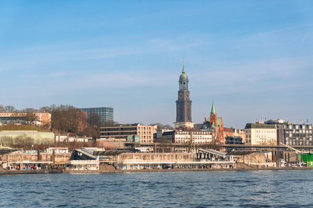 LandungsbrÃ¼cken and St. Michaelis Church in Hamburg, Germany on a sunny dayの写真素材