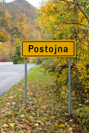Postojna Road Sign in Autumn Landscape, Sloveniaの写真素材