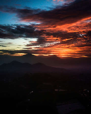 Vegetable plantation on mountain slope with sky at sunrise. The sky is cloudy in slope of Mount Sumbing. Silancur HIghlandの写真素材