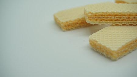 Tasty wafer sticks on white background, flat lay. Sweet foodの写真素材