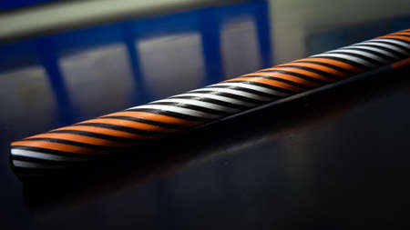 Striped pen on the table. top view copy space