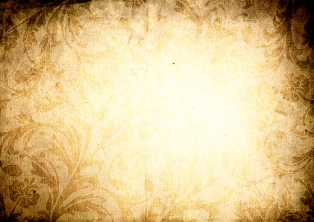 Aging paper background with vintage floral patterns and copy space for text.の写真素材