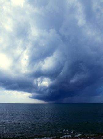 A storm from the ocean approaches the coastの写真素材