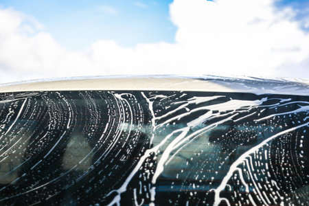 car washing, soap suds on carの写真素材