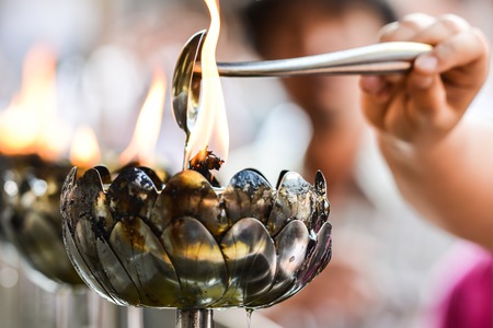 Burning candles in the Thaiand templeの写真素材