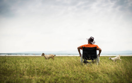 One man alone sitting in a wheel chairの写真素材