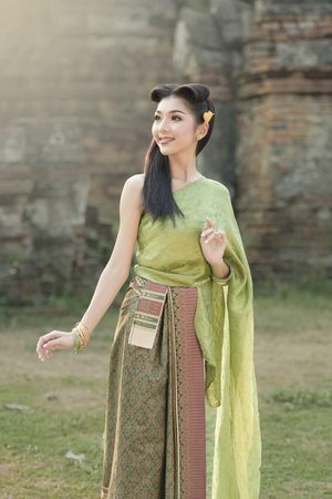 Beautiful Thai girl in Thai traditional costumeの写真素材
