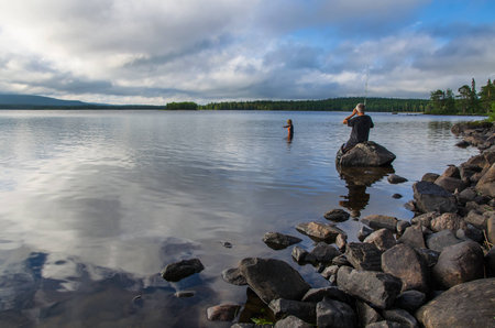 Wooded shore of a large lake. Forests along the coast. Kola Peninsulaの写真素材