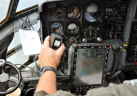 closeup of a pilots hand steering a military cargo planeのeditorial素材