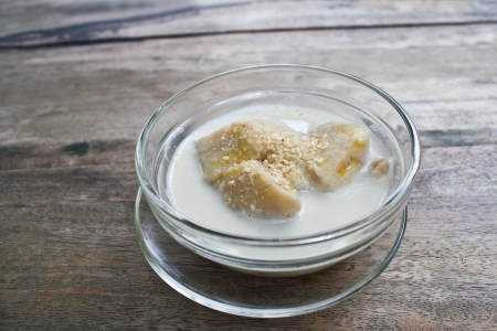 banana in coconut milk  sprinkle with sesame, thai dessertの写真素材