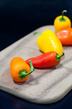 sweet pepper on choping blockの写真素材