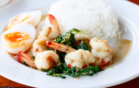 Stir-fried Thai basil with shrimp and boiled eggの写真素材