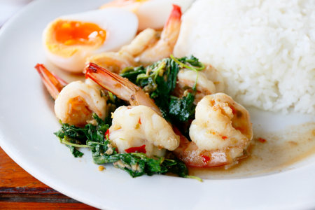 Stir-fried Thai basil with shrimp and boiled eggの写真素材